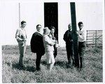F08_E12_01 Unidentified people discussing the movie by a barn used for the filming of "The Learning Tree," on location in Bourbon and Linn counties, Kansas by Unknown