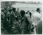 F10_E03_01 Gordon Parks walking past actors during Sarah's burial scene for "The Learning Tree," on location in Bourbon and Linn counties, Kansas by Unknown
