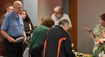 Guests at the Food Table by Rafael Tourinho Machado DE Almeida and Angel Abshire