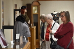 Guests Look at Displays by Rafael Tourinho Machado DE Almeida and Angel Abshire