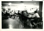 Students Sit at Tables by Unknown