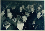German officers and civilians at a dinner by Unknown