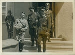 Adolf Hitler (second from left) talking to Hermann Goering (third from left) by Unknown
