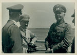 Adolf Hitler (second from left) talking to a German Luftwaffe officer by Unknown